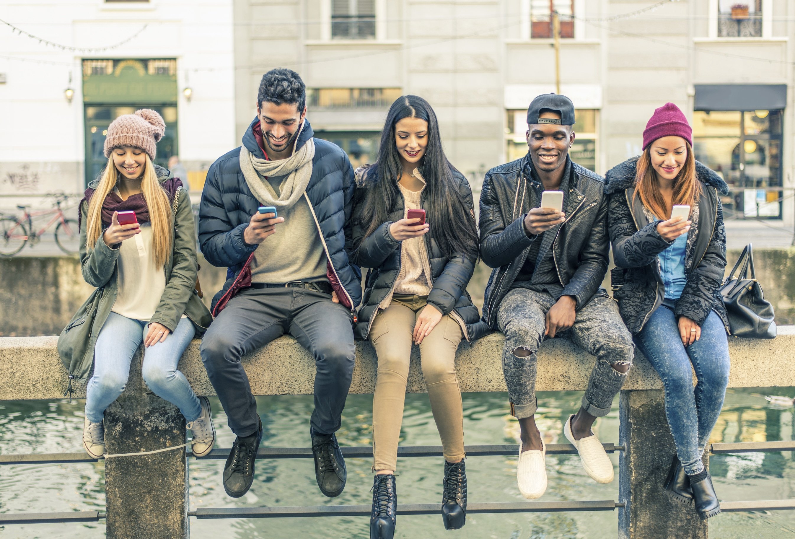 Multiracial group of people with cellphones Multiracial group of people with cellphones
